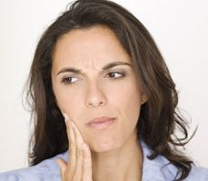 a woman with severe toothache